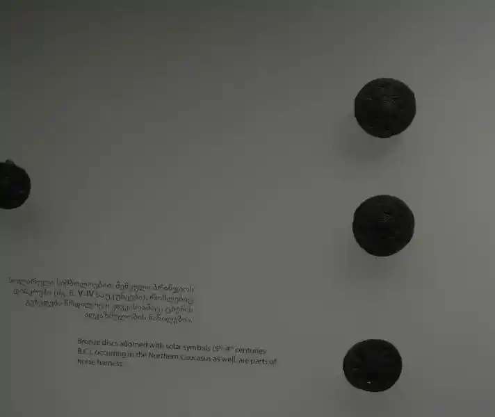 Bronze discs adorned with solar symbols